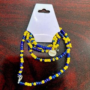 30 1/2in blue and gold belly chain with Gemini charm and birth stone